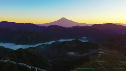 Wall Mural - Aerial view of mount Fuji with misty mountain in morning