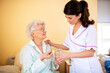© didesign - Two ladies working together, doctor and her nursing facility patient