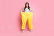 © deagreez - Full length portrait of funky playful person open mouth wear too big pants isolated on pink color background