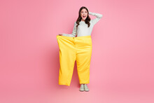 Full Body Photo Of Attractive Impressed Lady Hand On Head Open Mouth Stand In One Pant Isolated On Pink Color Background