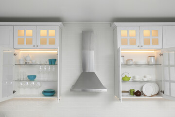 Poster - Open cabinets with different clean dishware in kitchen