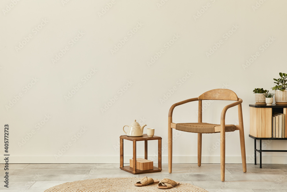 Neutral concept of living room interior with design wooden chair, round carpet, cup of coffee, tray, stool, slippers, decoration and elegant personal accessories. Template. Copy space. - obrazy, fototapety, plakaty 