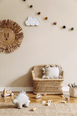 Wall Mural - Stylish scandinavian interior of child room with natural toys, hanging decoration, design furniture, plush animals, teddy bears and accessories. Beige walls. Interior design of kid room. Template.