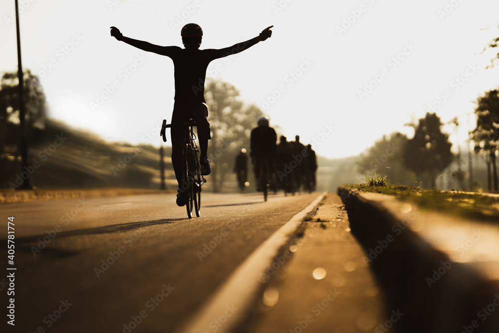 Cycling is training as a group, in the morning he pretends to finish line. - obrazy, fototapety, plakaty 