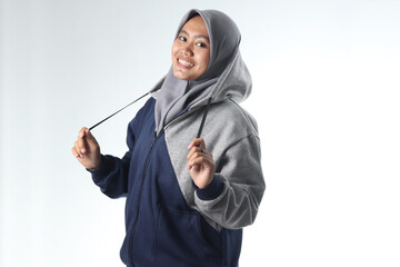 portrait of an Asian woman wearing casual clothes. hooded woman wearing gray jacket isolated on white background. beautiful woman with a happy expression