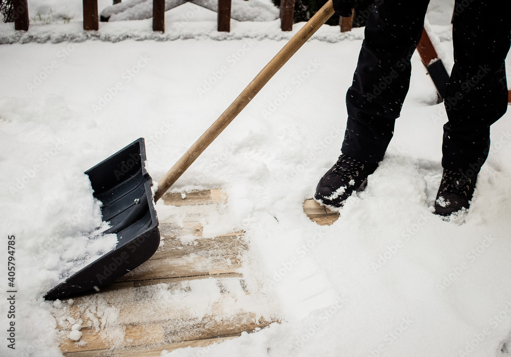 winter shoveling. Removing snow after blizzard - obrazy, fototapety, plakaty 