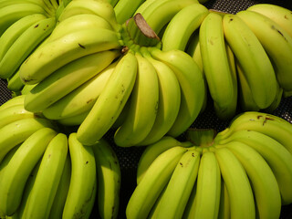 Wall Mural - Closeup shot of ripe bananas stuck together