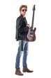 © sharplaninac - Handsome young rock music guitarist posing and holding electric guitar looking at camera. Full body isolated on white background.