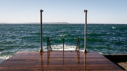 Wall Mural - wooden pier with sea background