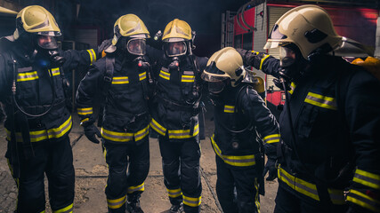 Wall Mural - Group of firefighters in the fire department checking their gas mask equipment