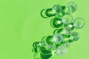 Sticker - Water glasses on a green background, trendy light and shadow