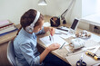 © Oksana Klymenko - Girl is drawing sitting at the table. Art, education, creativity, teenage hobbies