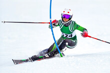 Snow Skier At A Gate On The Slalom Course