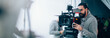 © Anna - Director of photography with a camera in his hands on the set.