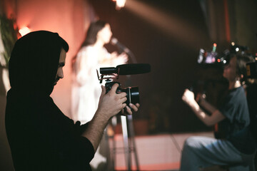 Director of photography with a camera in his hands on the set.