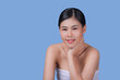 © NITIKAN T. - Beauty Spa Woman with perfect skin Portrait. Asian beautiful woman skin makeup young model, on blue studio