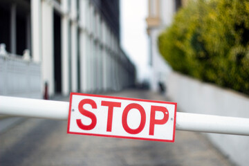 stop sign on the barrier in the city.