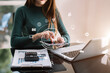 © NINENII - Businesswomen working with laptop and digital tablet computer in  office with digital marketing media in virtual icon.