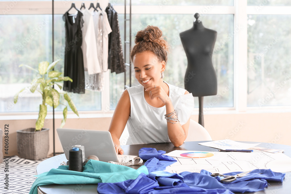 Female fashion designer working in studio