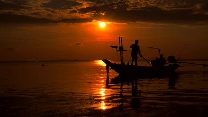 Wall Mural - Fisherman in a twilight sunset time