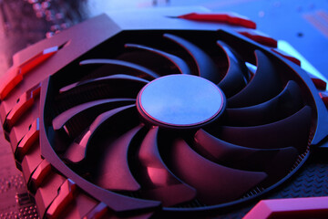 Poster - Computer game graphics card, videocard with two coolers on circuit board ,motherboard background. Close-up. With red-blue lighting