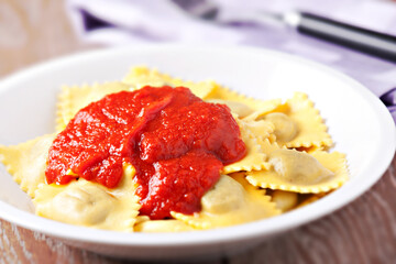 Sticker - Ravioli with tomato sauce. Typical italian dish.