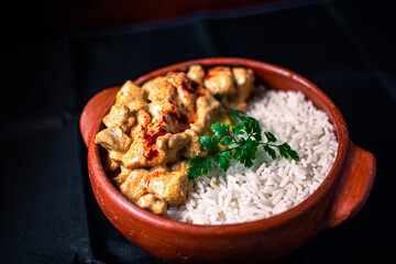 Wall Mural - Closeup of traditional Indian spicy lamb food with basmati rice in a bowl