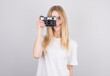 © Studio Nova - Happy smiling young girl holding camera and taking photos