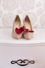 Wall Mural - Wedding accessories: bride's shoes, rings and boutonniere, bouquet