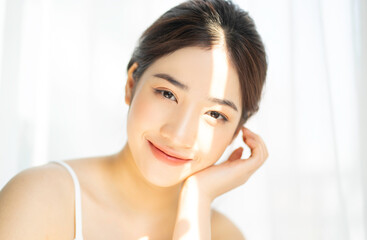 portrait of young asian girl under the sun