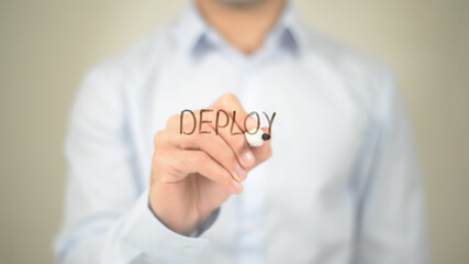 Deploy, Man writing on transparent screen