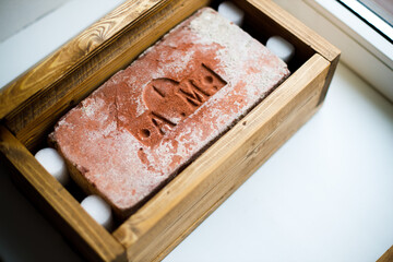 Poster - Russia. Vyborg 10.01.2021 old brick with a stamp in a wooden box