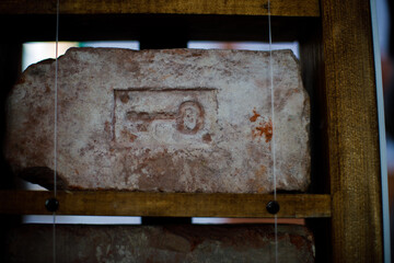 Poster - Russia. Vyborg 10.01.2021 old brick with a stamp on a wooden shelf