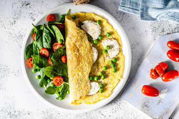 Wall Mural - Bio eggs omelet with salad