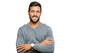 © Krakenimages.com - Handsome hispanic man wearing casual clothes happy face smiling with crossed arms looking at the camera. positive person.