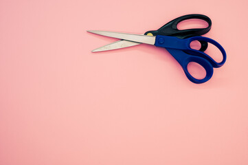 Poster - Couple of scissors isolated on a pink background