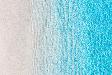 Wall Mural - waves as a background from top view. azure water background from drone. summer seascape from air. gi