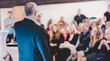 © kasto - Business man leading a business workshop. Corporate executive delivering a presentation to his colleagues during meeting or in-house business training. Business and entrepreneurship concept.
