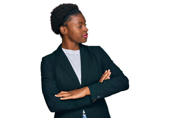 Poster - Young african american girl wearing business clothes looking to the side with arms crossed convinced and confident