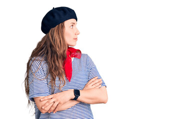 Sticker - Young beautiful blonde woman wearing french beret and striped t-shirt looking to the side with arms crossed convinced and confident