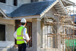 © เลิศลักษณ์ ทิพชัย - Foreman or young handsome Asian engineer Wear a helmet and a mask Control construction on the construction site