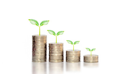 Plant growth on a falling pile of coins on white background financial idea in an economic downturn.