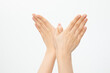 © Natalie Portman/Wirestock - Closeup shot of hands gesturing wings isolated on a white background