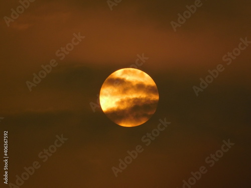 Low Angle View Of Moon Against Sky At Sunset