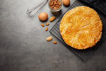 Traditional Galette Des Rois And Ingredients On Grey Table, Flat Lay. Space For Text