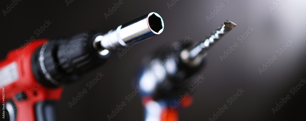 A screw gun and a pistol-grip cordless drill - obrazy, fototapety, plakaty 