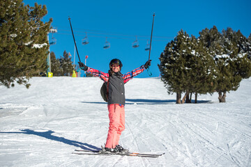 Young blonde woman skiing on a sunny day