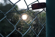 Close-up Of Chainlink Fence Against Sky