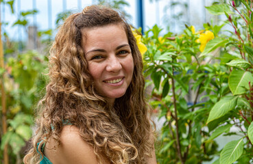 Brazilian blonde woman closeup in home garden