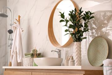 Sticker - Vase with beautiful branches and toiletries near vessel sink in bathroom. Interior design